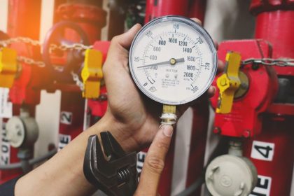 pressure gauges of gas pipe in hand of maintenance man