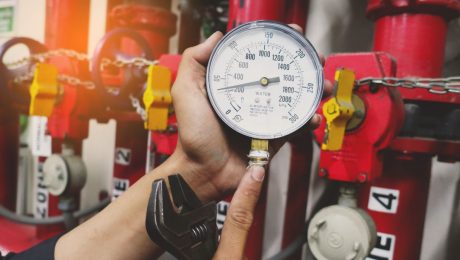 pressure gauges of gas pipe in hand of maintenance man